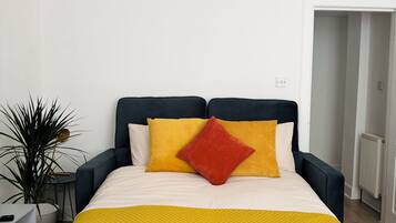 1 bedroom, desk, iron/ironing board, travel crib