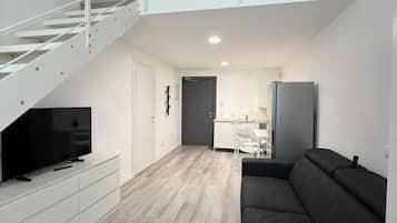 Deluxe Apartment | Living area | TV