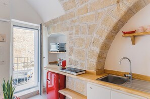 Romantic Duplex, Sea View | Private kitchen | Fridge, microwave, high chair, cookware/dishes/utensils - Seafront Apartments by Carlo V Castle, Monopoli Old Town - HelloAPULIA Al Castello di Amec (Monopoli)