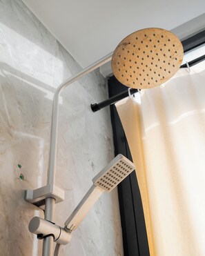 Hand-held showerhead - Comfortable studio apartment in prime Masaki location (Dar es Salaam)