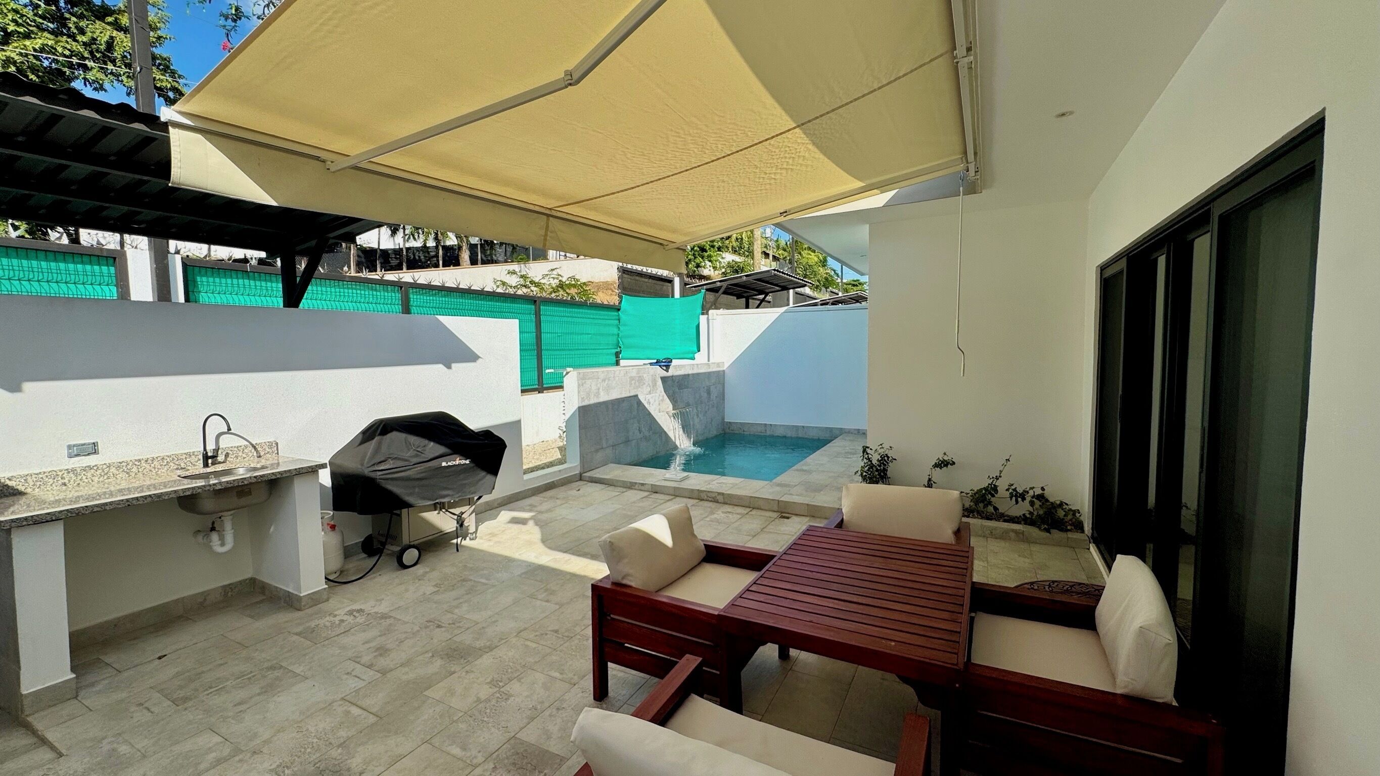 Private Outdoor Patio with a BBQ and pool