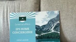 A brochure with a mountain and lake view, titled "SPS HOME CONCIERGERIE" with a contact location note. - Pieds des Pioupiou - 6 posti letto | La Foux d'Allos (Provence -Alpes-Cote D'azur)