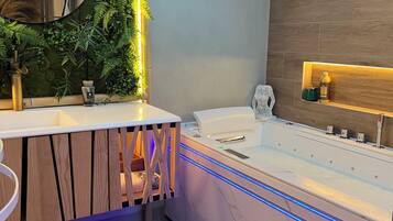 Jetted tub, hair dryer, towels, soap