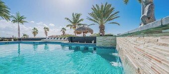Spectacular Kamay Hills mansion with panoramic island views. Just 3 minutes from Aruba’s best beaches. Features the largest residential pool on the island and space for up to 24 guests. Ideal for luxury group getaways.