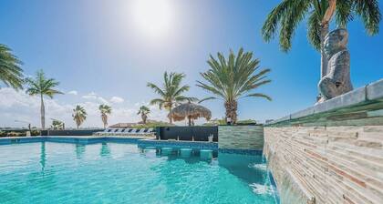Spectacular Kamay Hills mansion with panoramic island views. Just 3 minutes from Aruba’s best beaches. Features the largest residential pool on the island and space for up to 24 guests. Ideal for luxury group getaways.