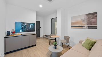 Deluxe Studio Suite | Living area | TV