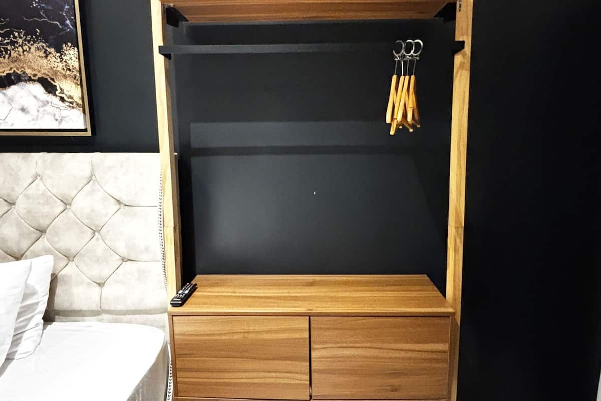 Desk, laptop workspace, blackout curtains, iron/ironing board