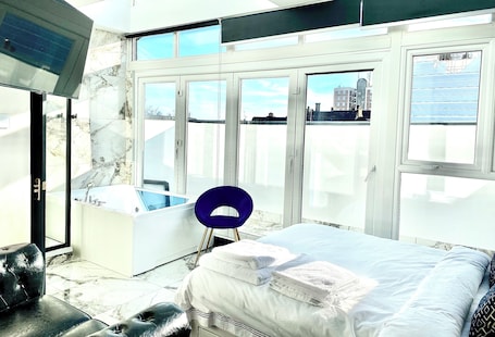 Desk, laptop workspace, blackout curtains, iron/ironing board. BPR Private Hot-tubs and rooms