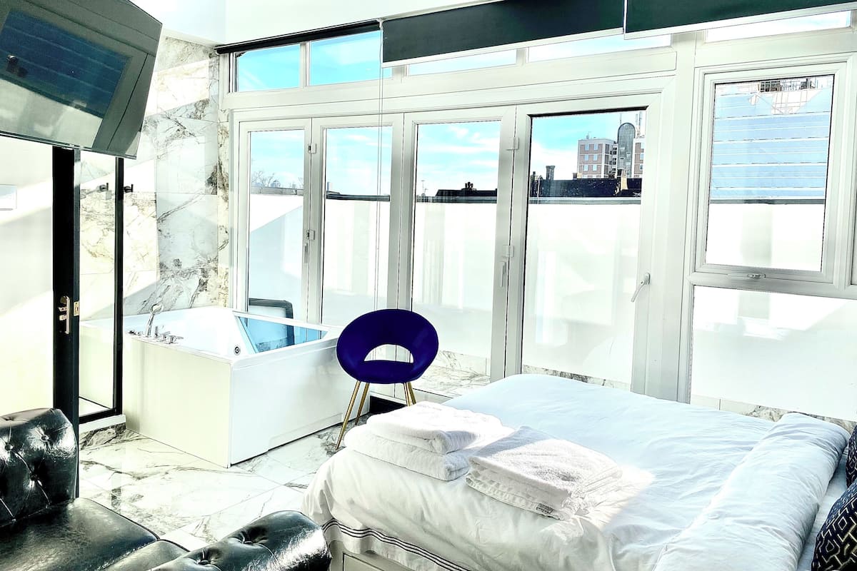 Desk, laptop workspace, blackout curtains, iron/ironing board