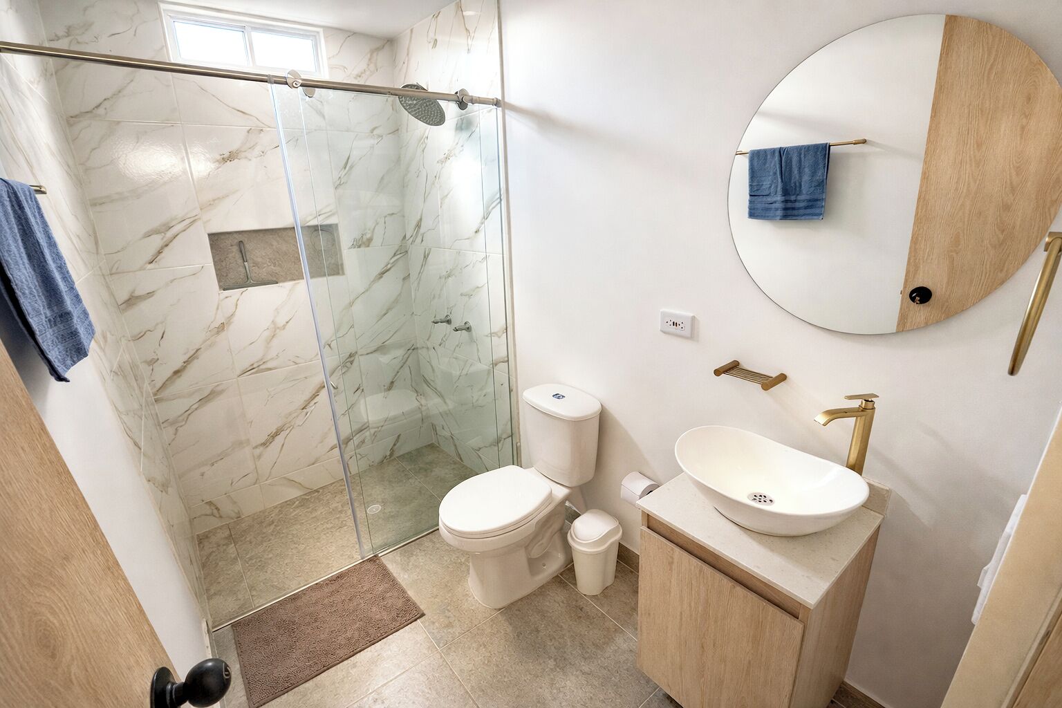 Shower, towels, soap, toilet paper