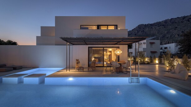 A modern outdoor pool area with a covered seating area and a view of a mountain. - Bianco Boutique Villas - Eve (33F2+9P2 Pefki, Greece)