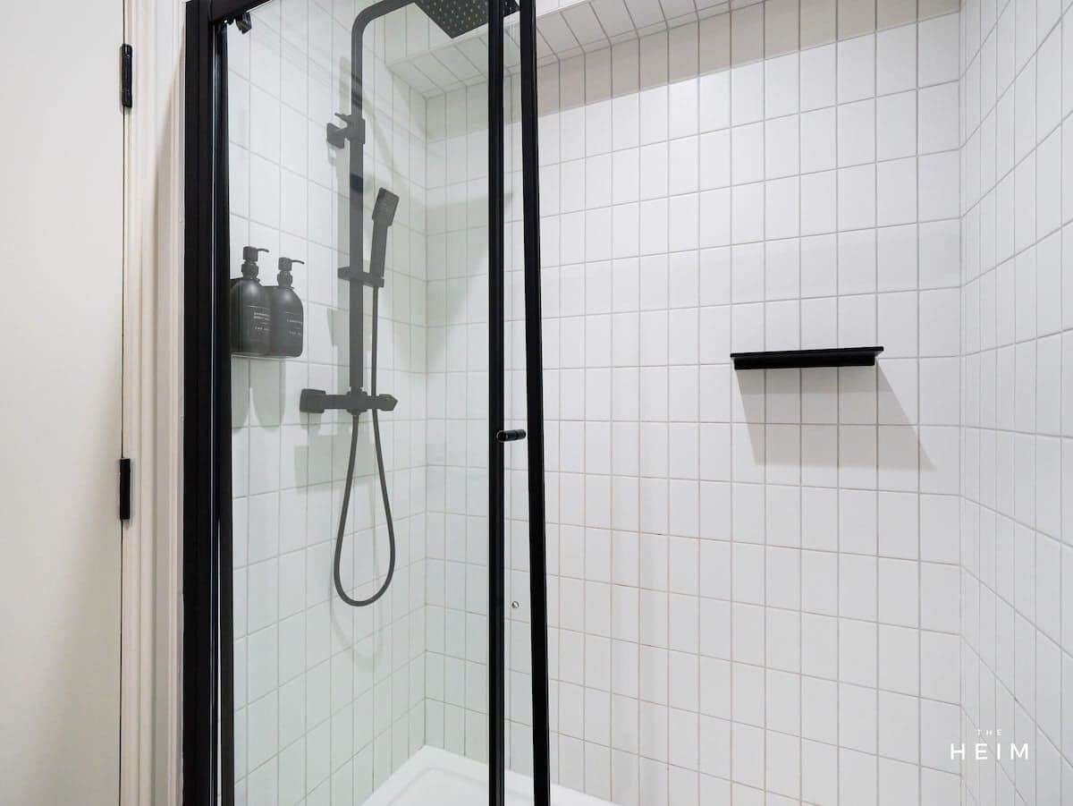 Shower, hair dryer, towels, shampoo