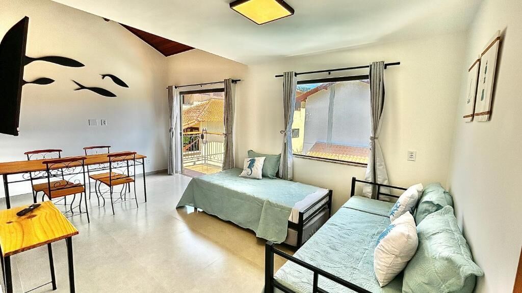Apartamento família, cozinha americana, vista para a piscina | Parte interna