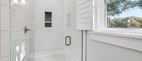 Shower, hair dryer, towels, shampoo