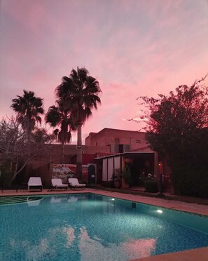 Outdoor pool, open 9:30 AM to 11:00 PM, sun loungers