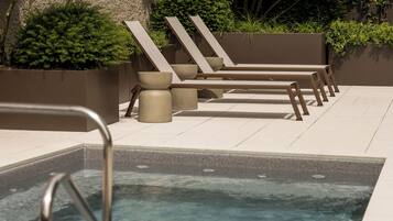 Seasonal outdoor pool, pool loungers