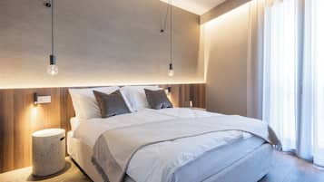 Premium bedding, down comforters, memory foam beds, in-room safe