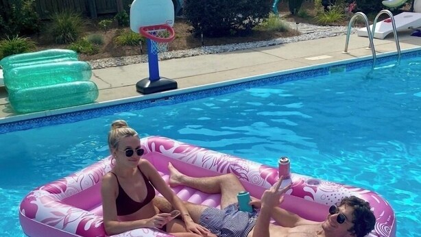 A swimming pool with inflatable floats. - 4-bedroom house in adorable Pinehurst with cozy living spaces (Pinehurst)