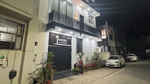 A two-story building with a sign for 'Jasmin A unit of Stay House'. - Jasmin A Luxury Stay (Agra)