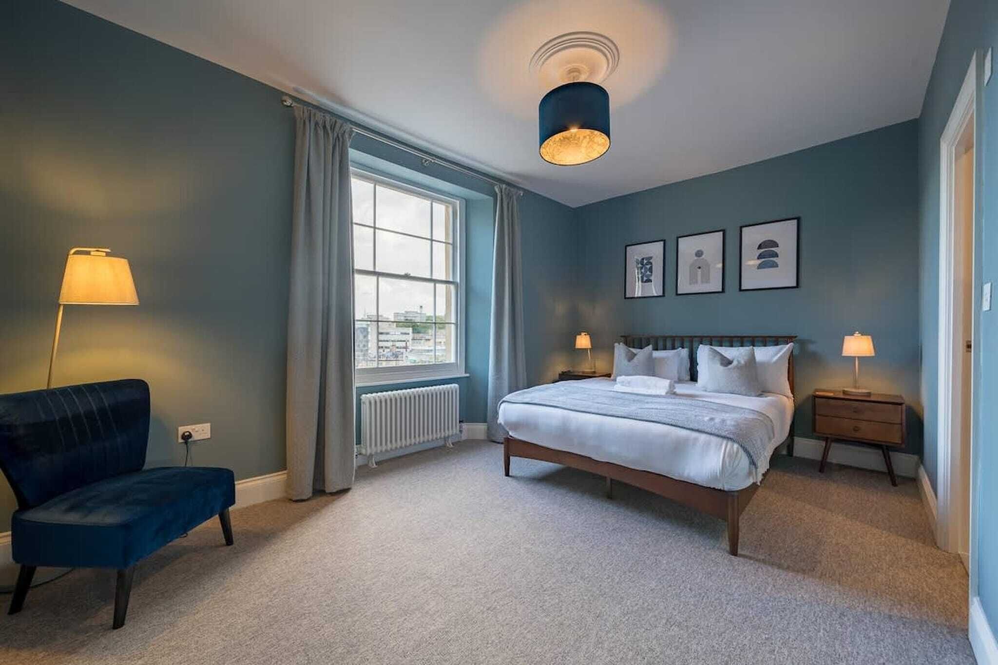 Desk, iron/ironing board, bed sheets