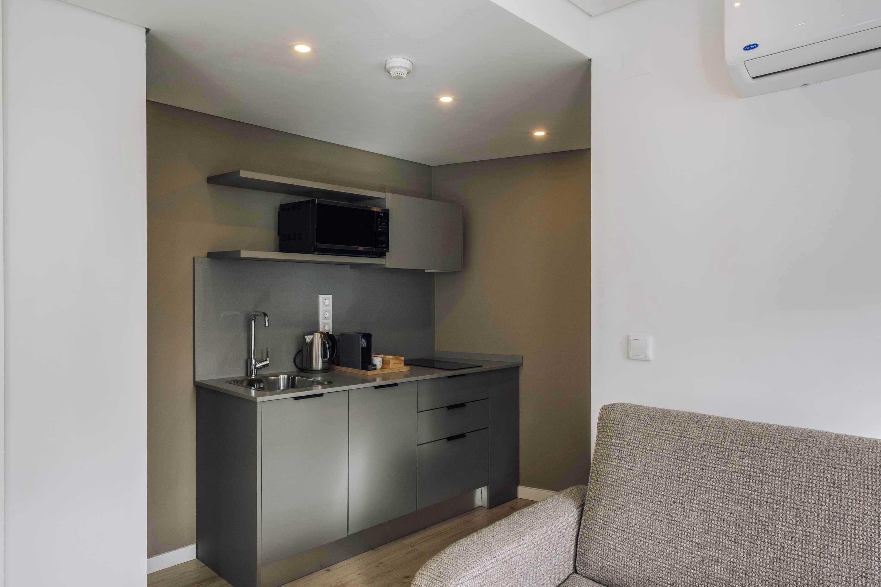Family Suite | Private kitchen | Mini-fridge, coffee/tea maker, electric kettle, high chair