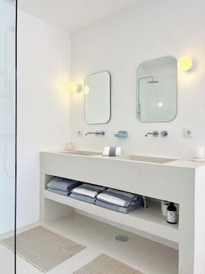 Shower, hair dryer, towels, soap