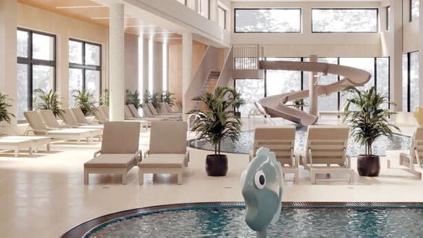 Amplia zona de piscina interior con sillones de descanso, una fuente central y una escalera que conduce a un nivel superior.