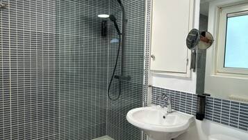 Shower, hair dryer, towels, soap
