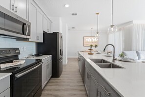Fridge, microwave, oven, dishwasher - Luxury 4BR Townhome w/ Pool | Champions Gate (Kissimmee)