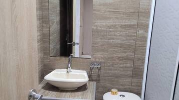 Shower, towels, soap, toilet paper