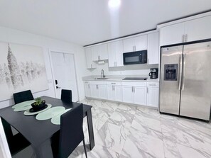 Fridge, microwave, stovetop, coffee/tea maker