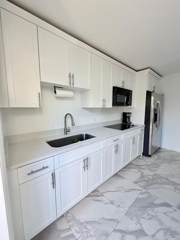 Fridge, microwave, stovetop, coffee/tea maker