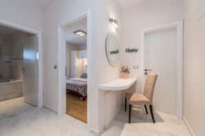 A modern bathroom with a glass shower enclosure and a separate toilet area. - Sargas Suite 2 With sea View (Novalja)