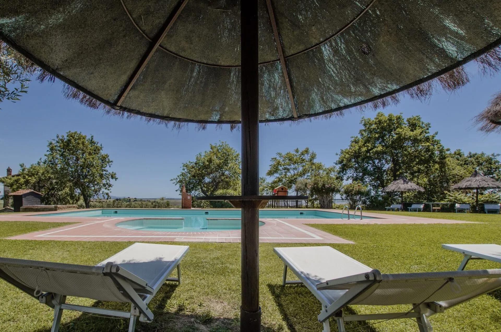 Seasonal outdoor pool, pool umbrellas, pool loungers