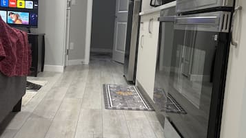 Coffee/tea maker, fridge, microwave, oven