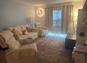 Living area - 2 bedroom pool condo both with king beds.  Across the street from the beach!! (Cape Canaveral)