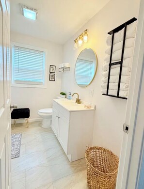 Hair dryer, towels, soap, toilet paper