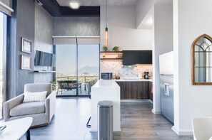 City Suite, City View | Living area | 48-inch Smart TV with digital channels, streaming services - Magnus (Monterrey)