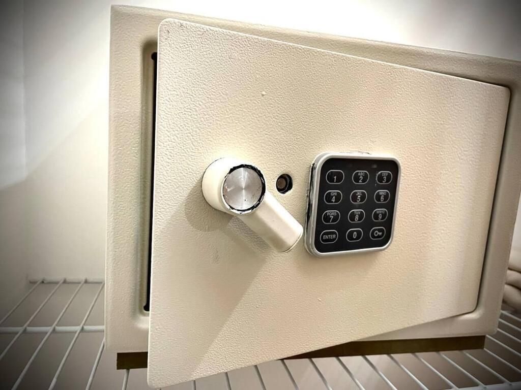 A safe with a combination dial and a keypad.