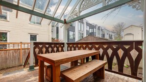 A wooden deck with a bench, surrounded by a wooden fence and a glass enclosure. - NEW The Cap Hill Heartbeat | Walk to Shops & Cafés (Seattle)