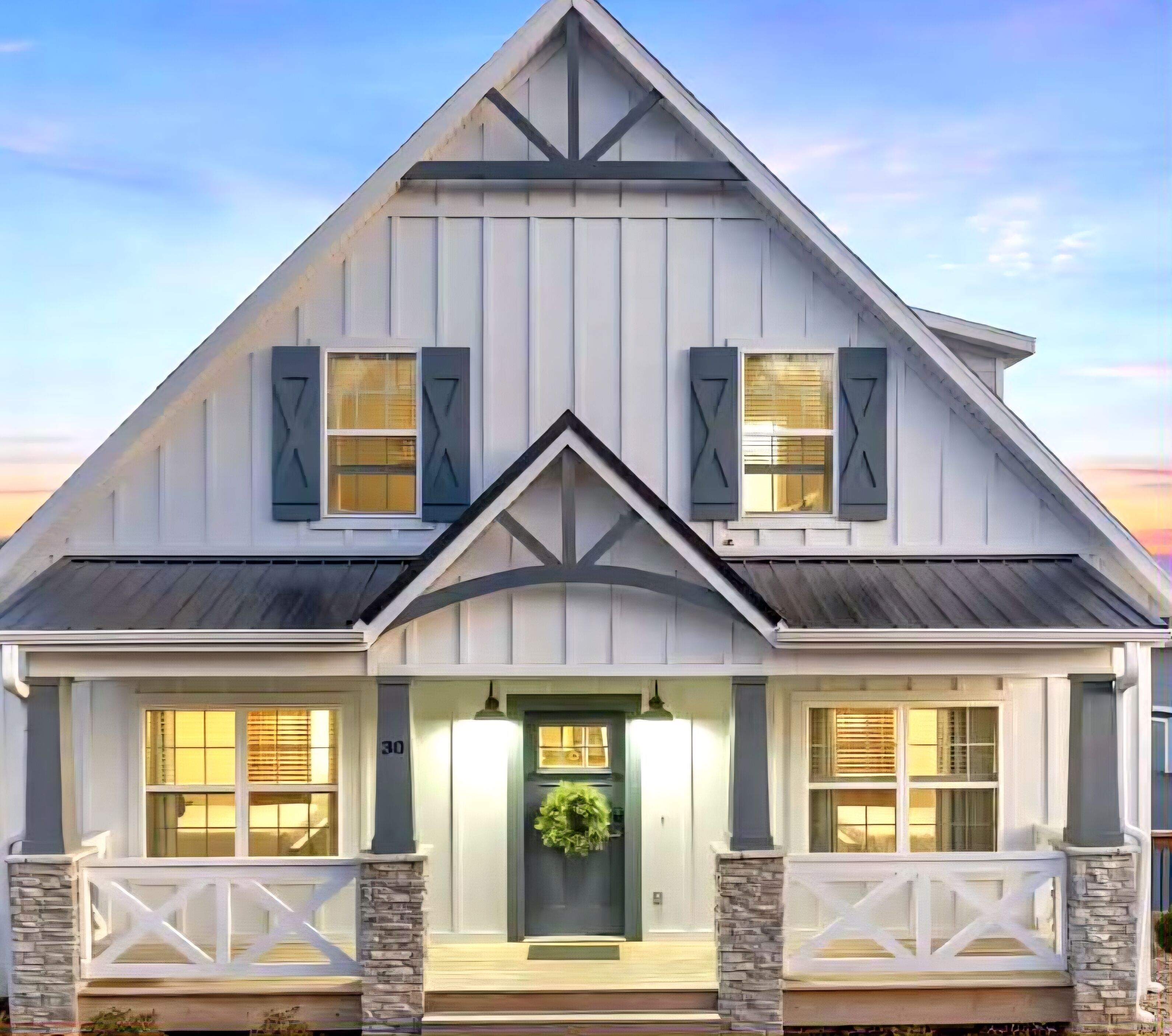 A two-story house with a gabled roof, a front porch with stone pillars, and a number '30' on the door.