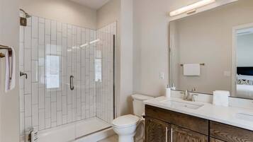 Shower, hair dryer, towels, shampoo