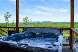 A hot tub with a view of a forest and mountains. - Family-Friendly Luxury Cabin SLIDE+SWINGSET+Movie Room - Hot Tub & Mountain View (Piercetown)
