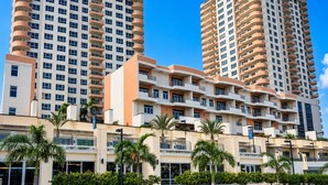 A high-rise hotel with multiple floors, balconies, and a flat roof. - Exquisite One-bedroom Condo • City View • Port of Spain • Modern • Vibrant • (Port of Spain)