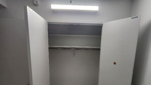 A walk-in closet with a wooden floor, white walls, and a ceiling-mounted light fixture. - Long term,1 bdr/apt in BRKL Barklay Ctr,move-out Oct1st, availableNOW,3,450month (Brooklyn)