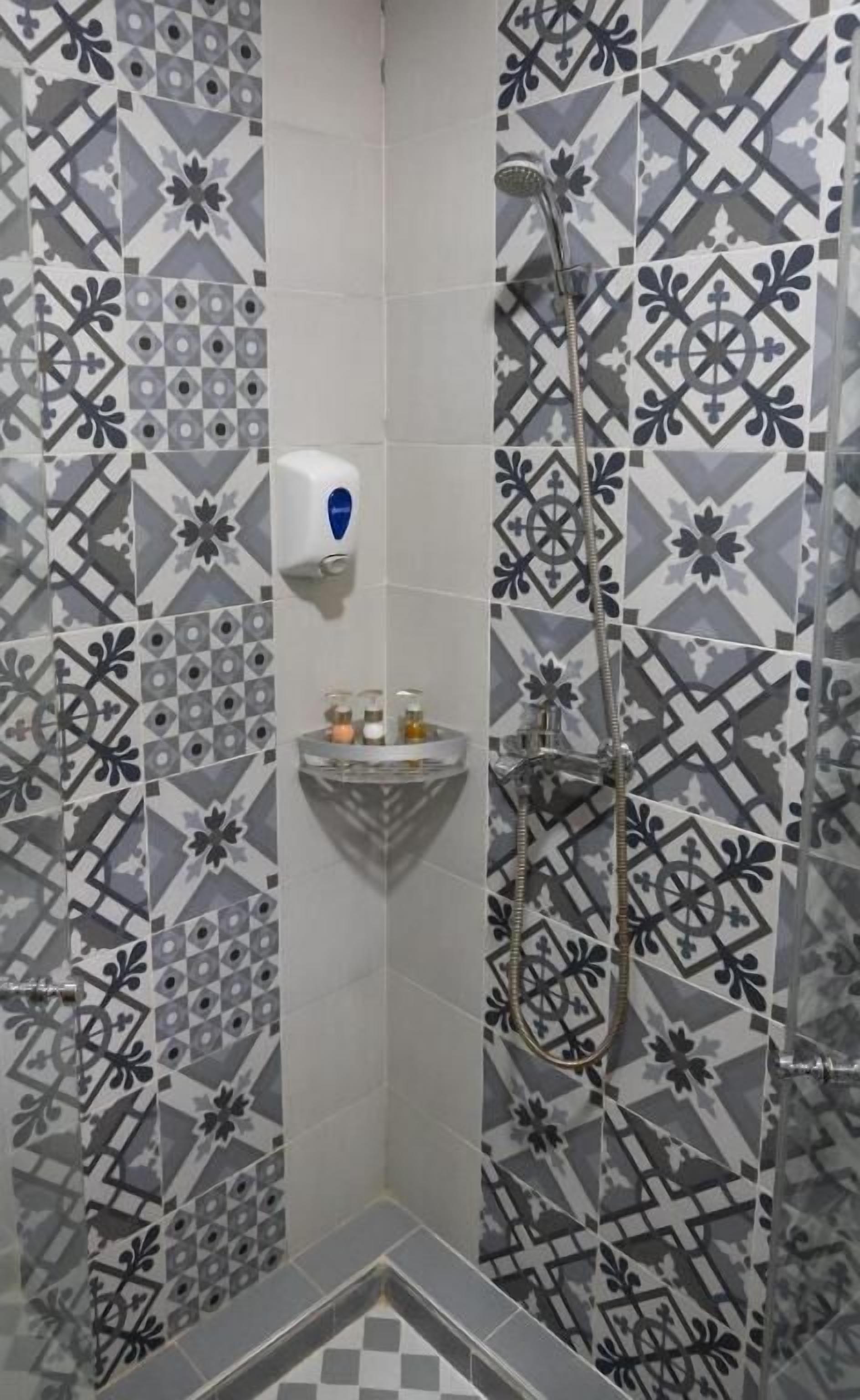 Suite, Pool View | Bathroom | Shower, hair dryer, towels