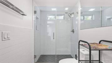 Shower, hair dryer, towels, shampoo