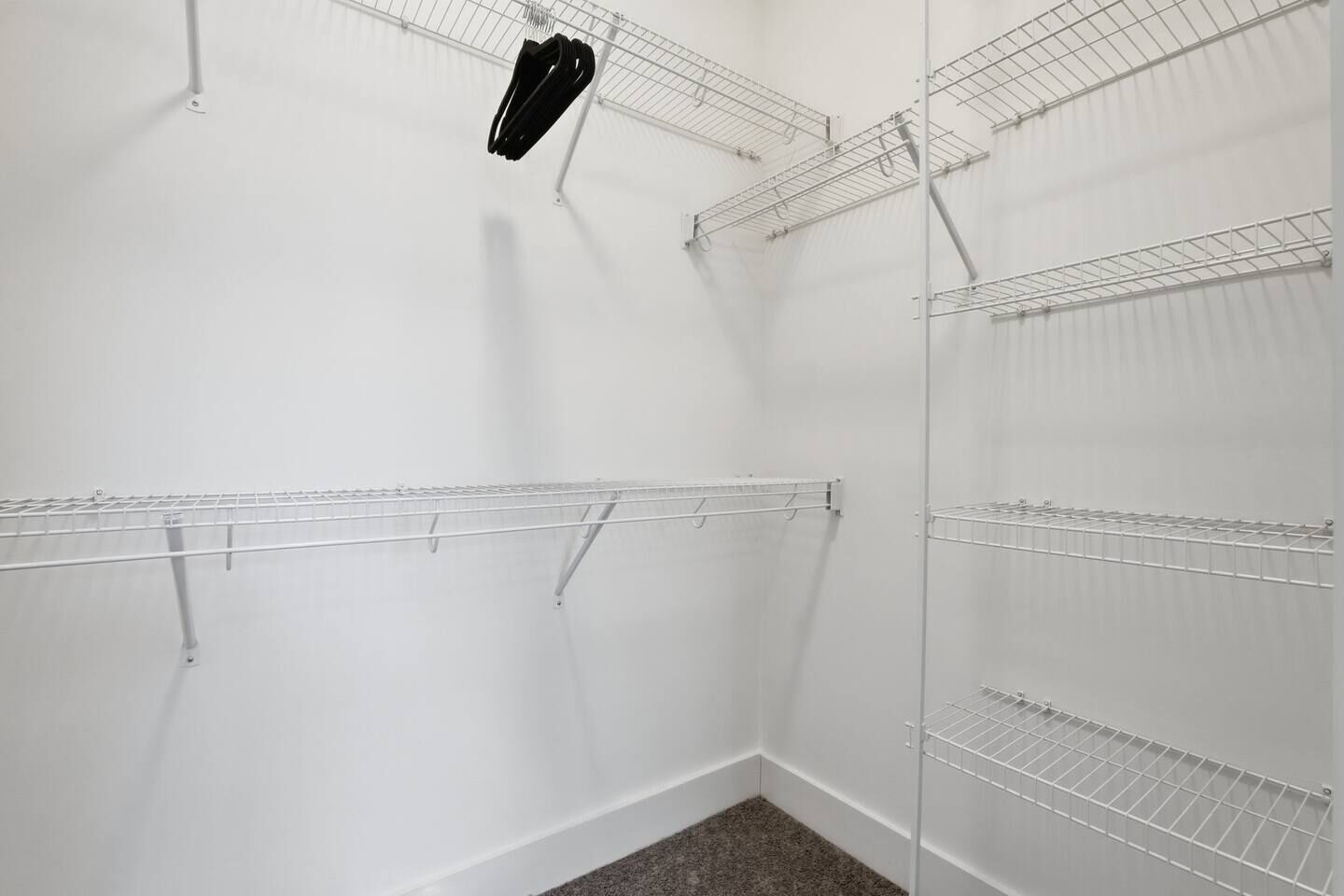 A storage closet with metal shelving units.