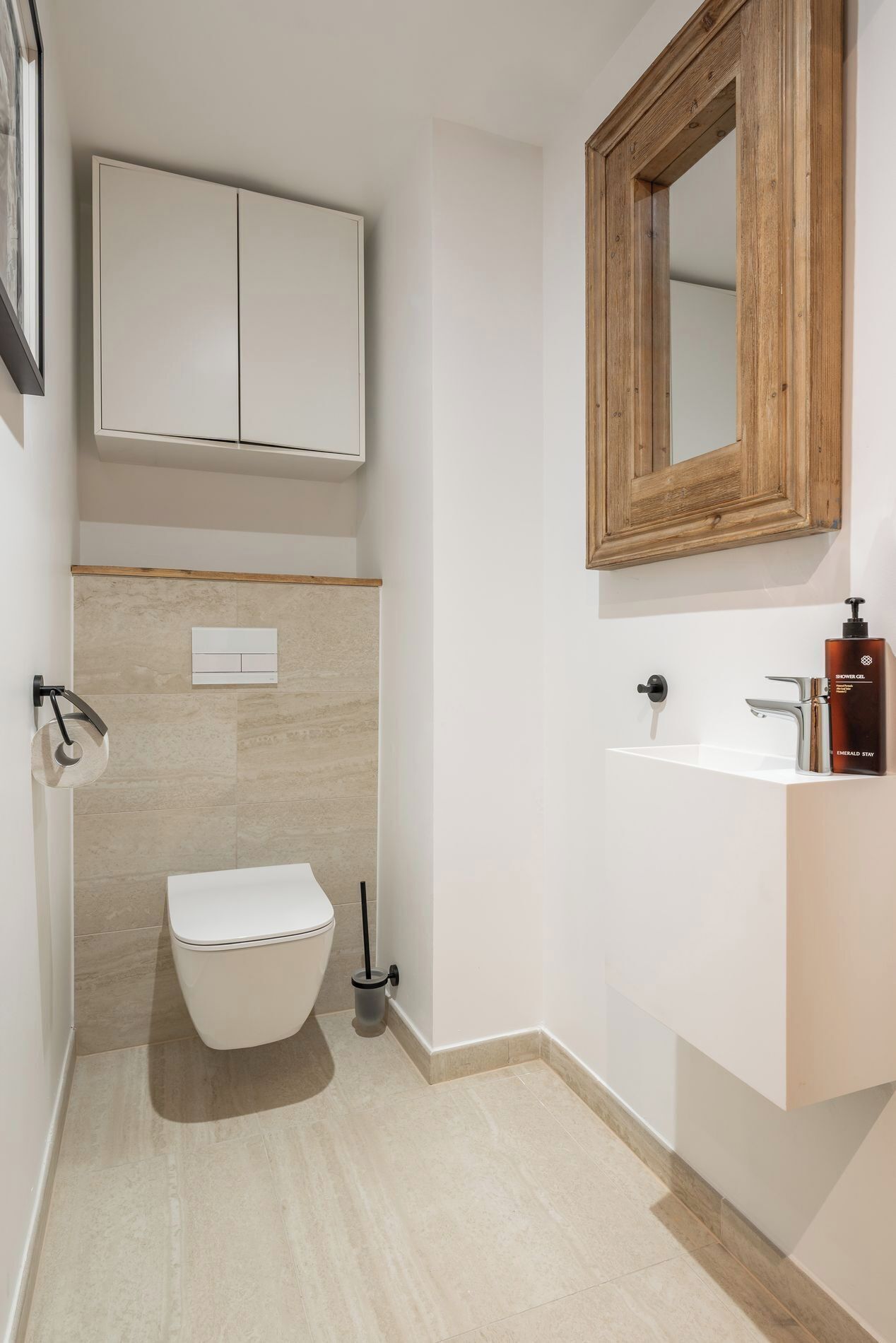 A bathroom with a toilet, a sink, and a shower.