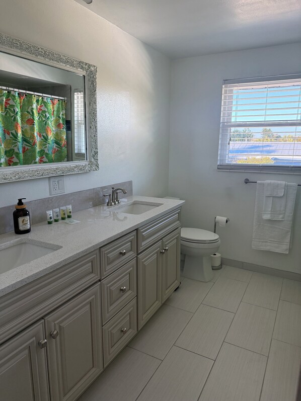 Shower, hair dryer, towels, soap